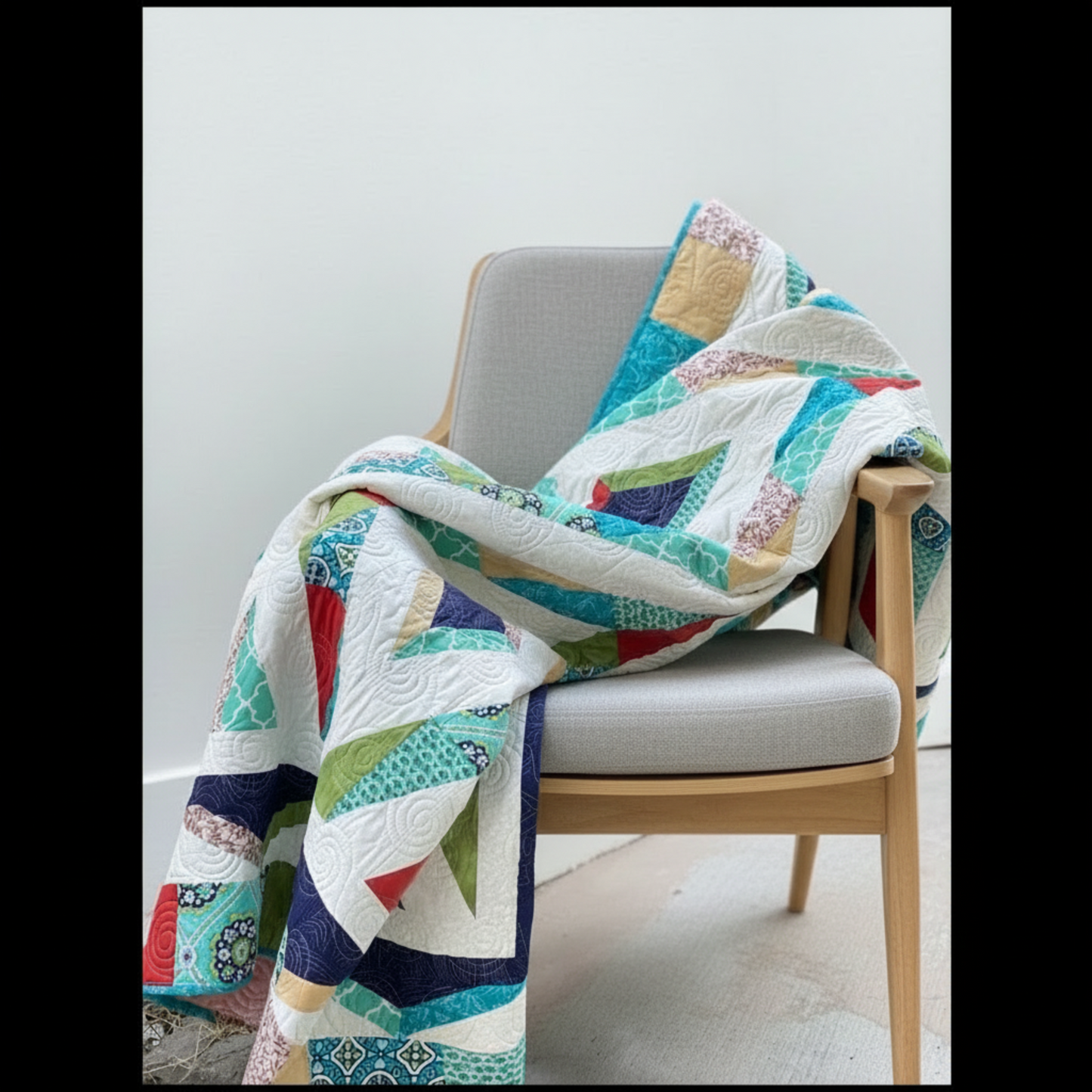 Folded Prism handmade quilt highlighting bold colors and textured quilting
