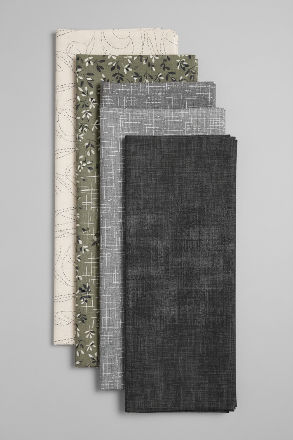 Interwoven Dark Slate by Jason Yenter – Pinterest fabric coordination stack of 3–5 fabrics on light grey background