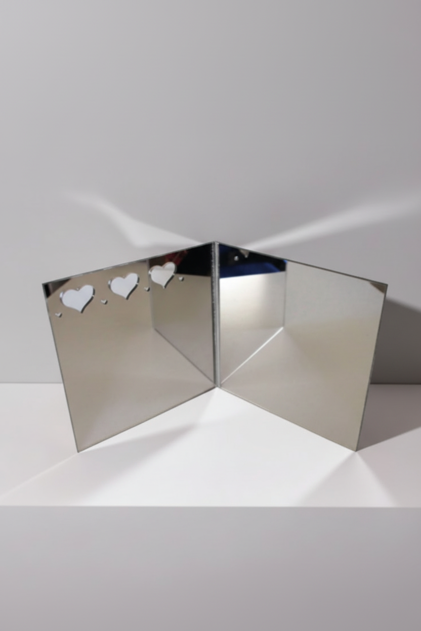 Sue Daley Designs fussy cutting mirror opened and standing, showing reflective panels for quilt fabric preview