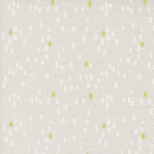 Olive You Dots Fog Fabric by Zen Chic for Moda Fabrics, close-up of white dots and lime-green accents on pale fog gray.