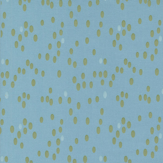 Olive You Dots Glacier Fabric by Zen Chic for Moda Fabrics, close-up of green and pale oval dots on a glacier-blue background.