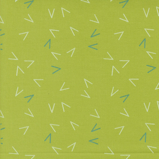 Close-up of Olive You Arrows Leaf fabric by Zen Chic for Moda Fabrics, with scattered white and blue-green arrow marks on a leaf-green background.