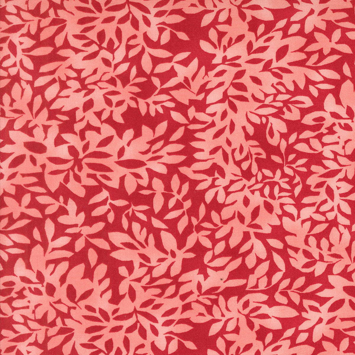 Superbloom Leafy Geranium fabric by Robin Pickens for Moda Fabrics, featuring overlapping coral-pink leafy branches on a rich red ground.