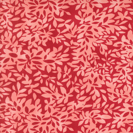 Superbloom Leafy Geranium fabric by Robin Pickens for Moda Fabrics, featuring overlapping coral-pink leafy branches on a rich red ground.