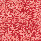Superbloom Leafy Geranium fabric by Robin Pickens for Moda Fabrics, featuring overlapping coral-pink leafy branches on a rich red ground.
