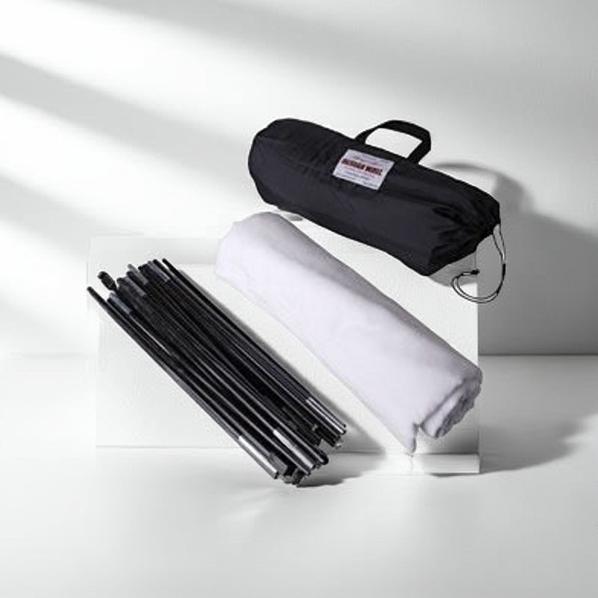 Portable quilt design wall disassembled with poles and carry bag