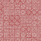 Detailed view of Breezeway Medium Red Tiles fabric by Maywood Studio, showing layered cream geometric motifs and medallion-style blocks on a warm red ground.