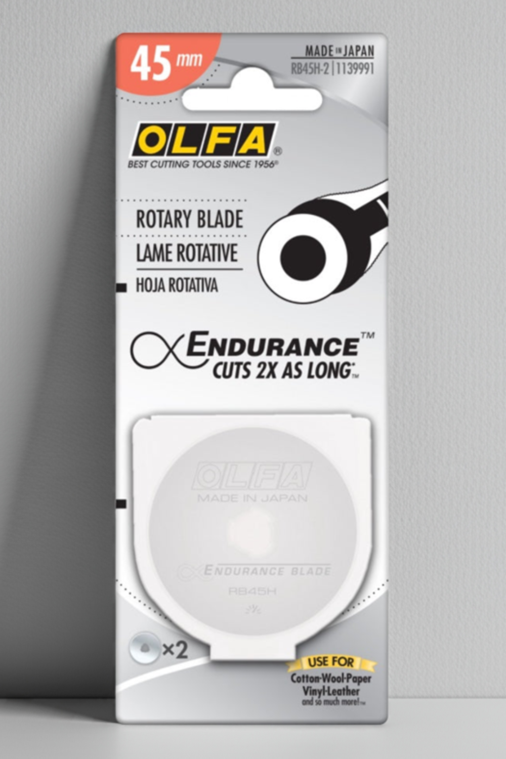 OLFA rotary blade packaging on a gray background