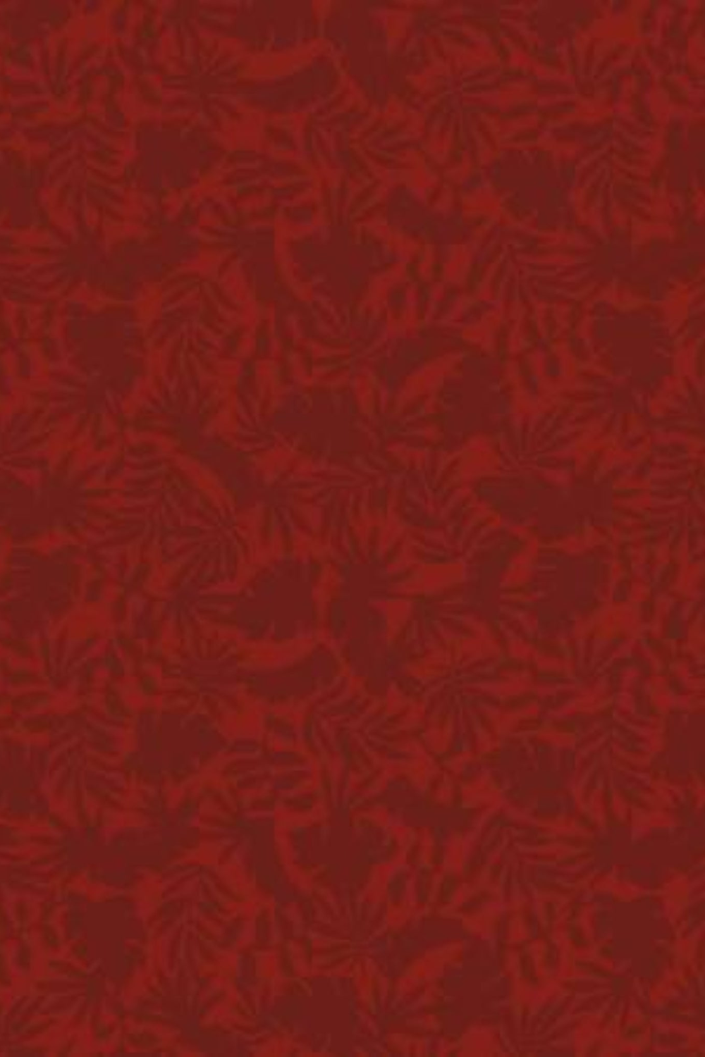 Detailed view of Breezeway Dark Red Mini Palms quilting cotton by Maywood Studio, featuring a subtle all-over palm-leaf pattern on a rich red background.