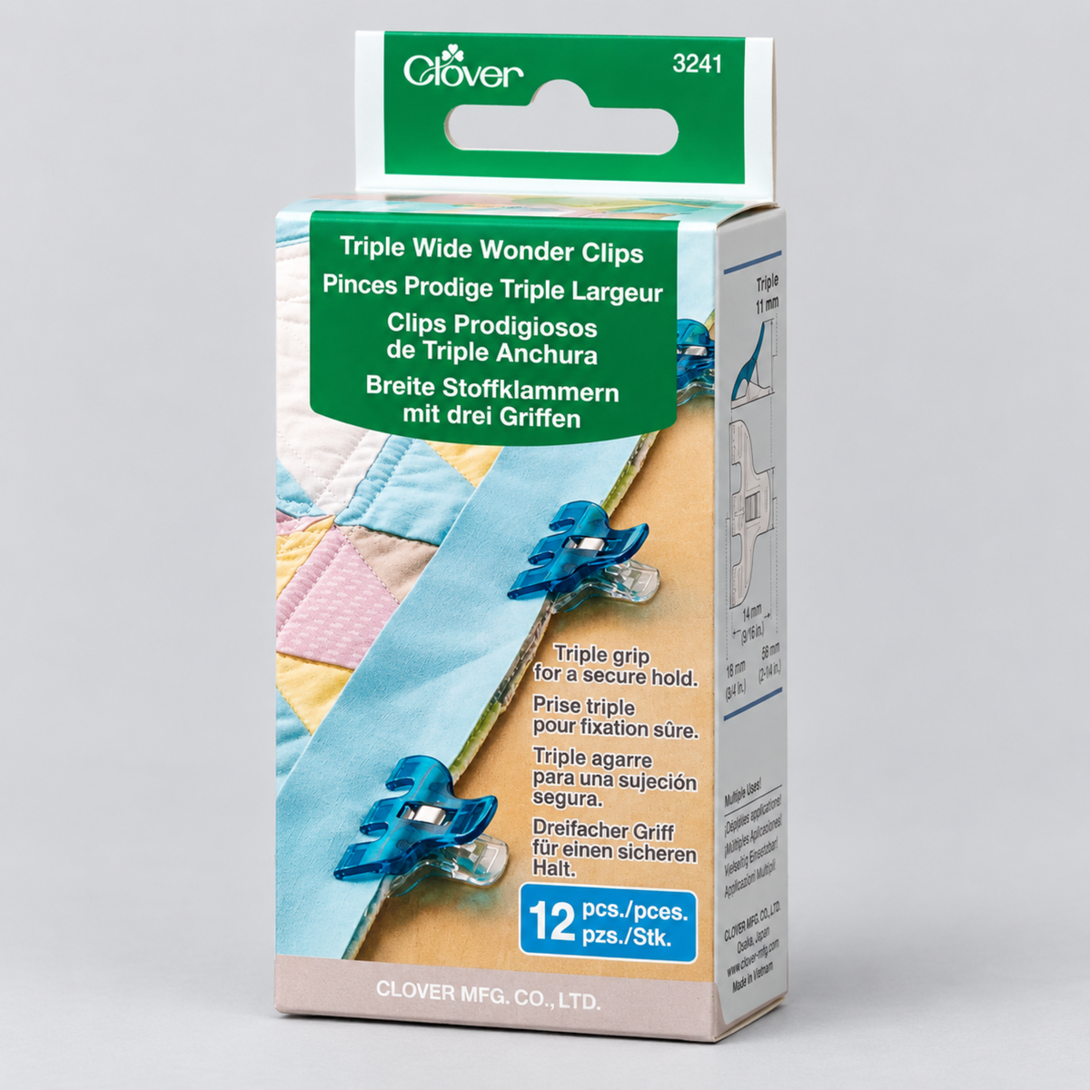 Clover Triple Wide Wonder Clips 3241 packaging showing 12 blue plastic clips securing quilt binding on a patchwork quilt