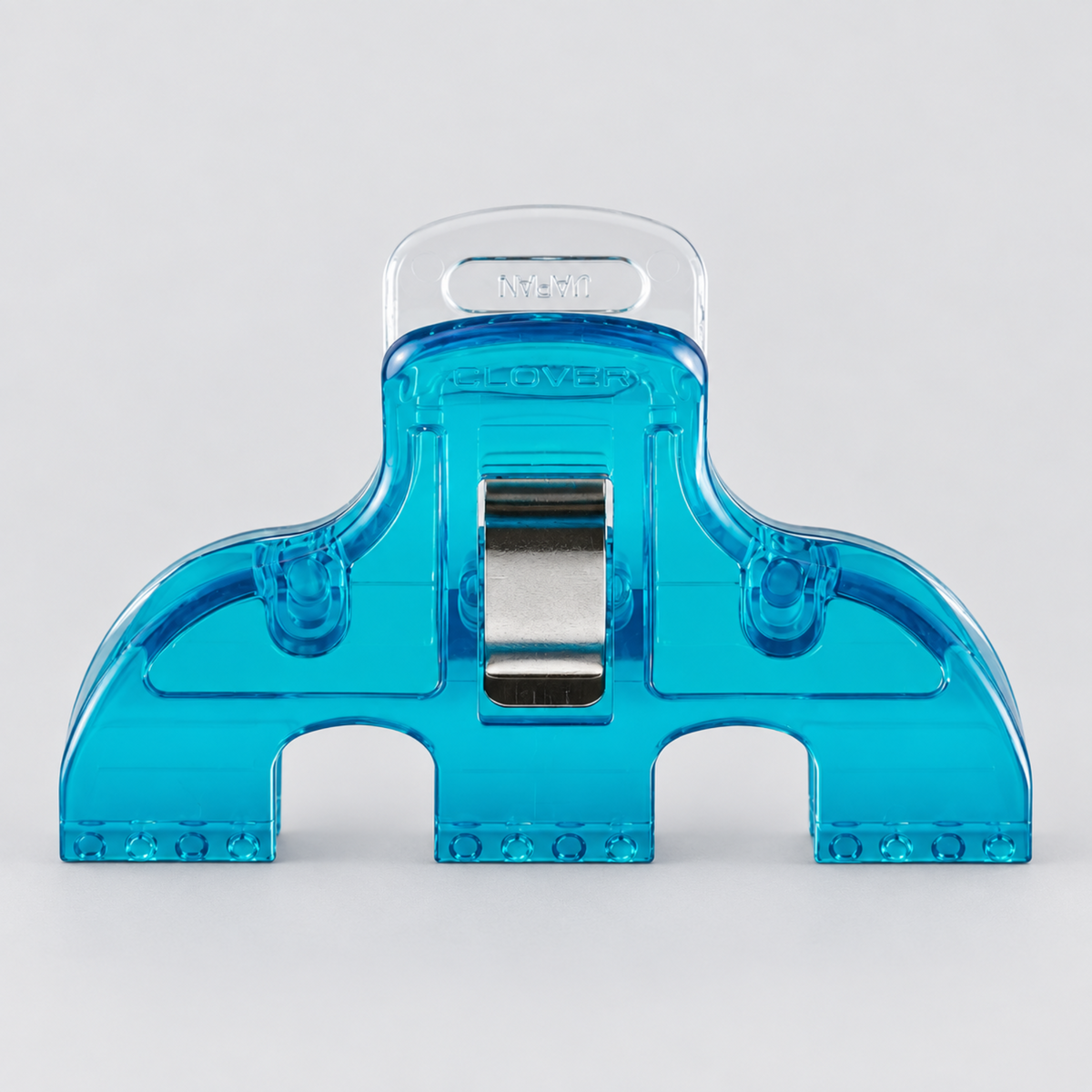 Close-up front view of a single Clover Triple Wide Wonder Clip showing the wide triple-grip blue plastic body and center metal spring mechanism
