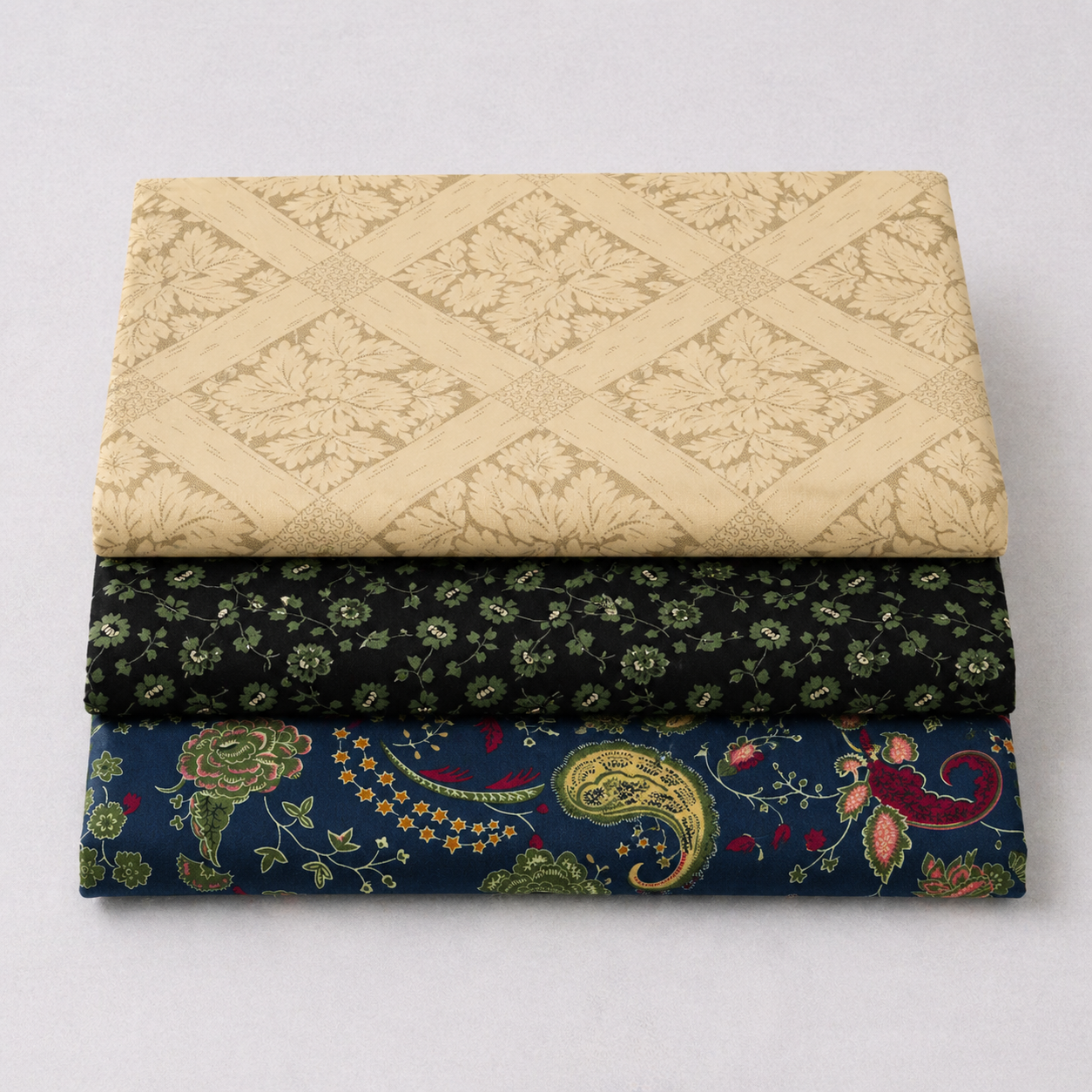 Vintage Charm Green Flower Patch fabric coordination stack – cream lattice, black green ditsy floral, and navy paisley reproduction cottons by Marcus Fabrics for traditional quilting