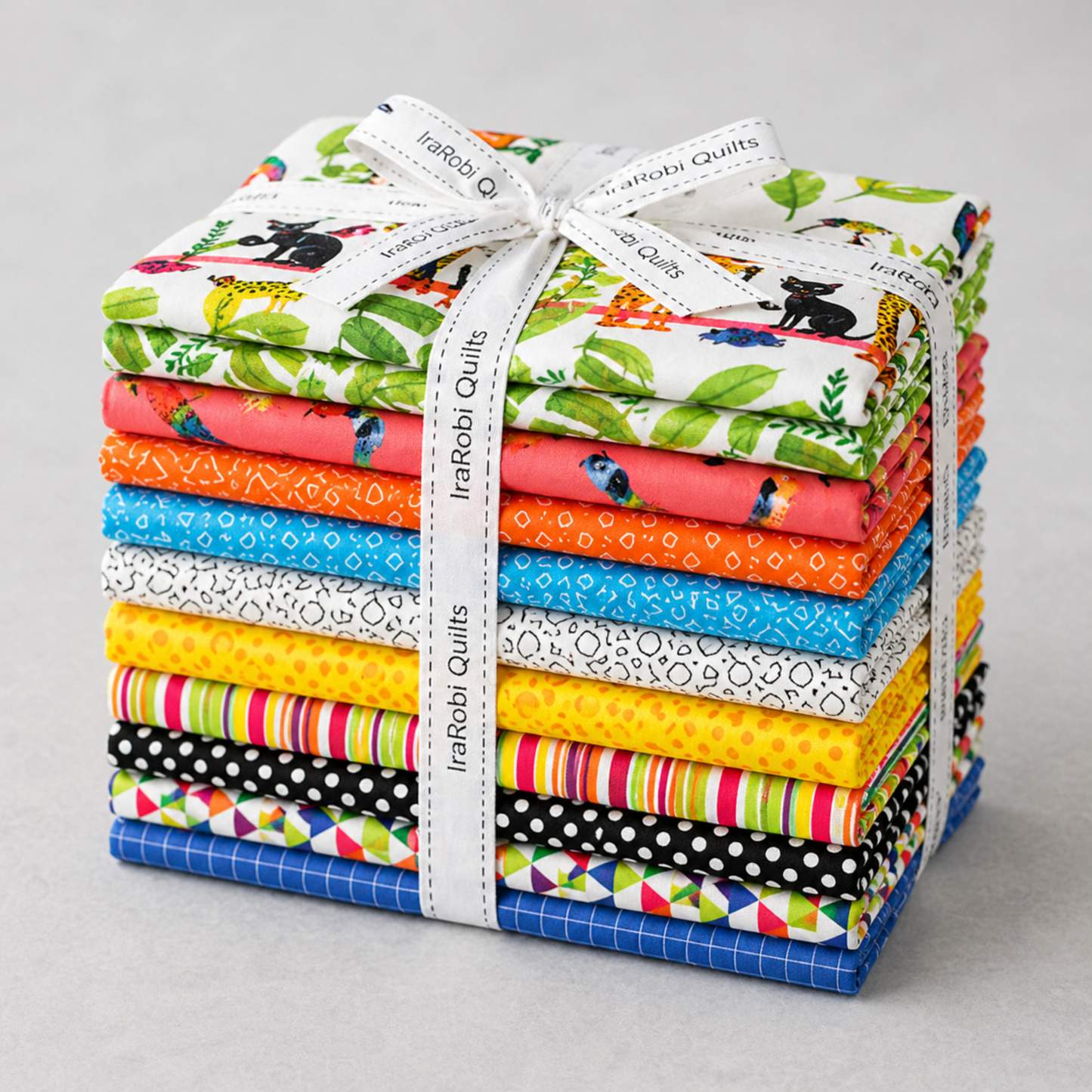 Fat quarter bundle tied with IraRobi Quilts ribbon — 14 coordinating quilting cottons including Safari Fun jungle animals, leaves, parrots, stripes, and geometric prints