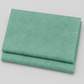 Spotted Chill-Aqua fabric by Zen Chic for Moda Fabrics — soft aqua-teal ground with scattered multi-toned dot texture, 100% cotton quilting blender, 44–45" wide. Available at IraRobi Quilts.