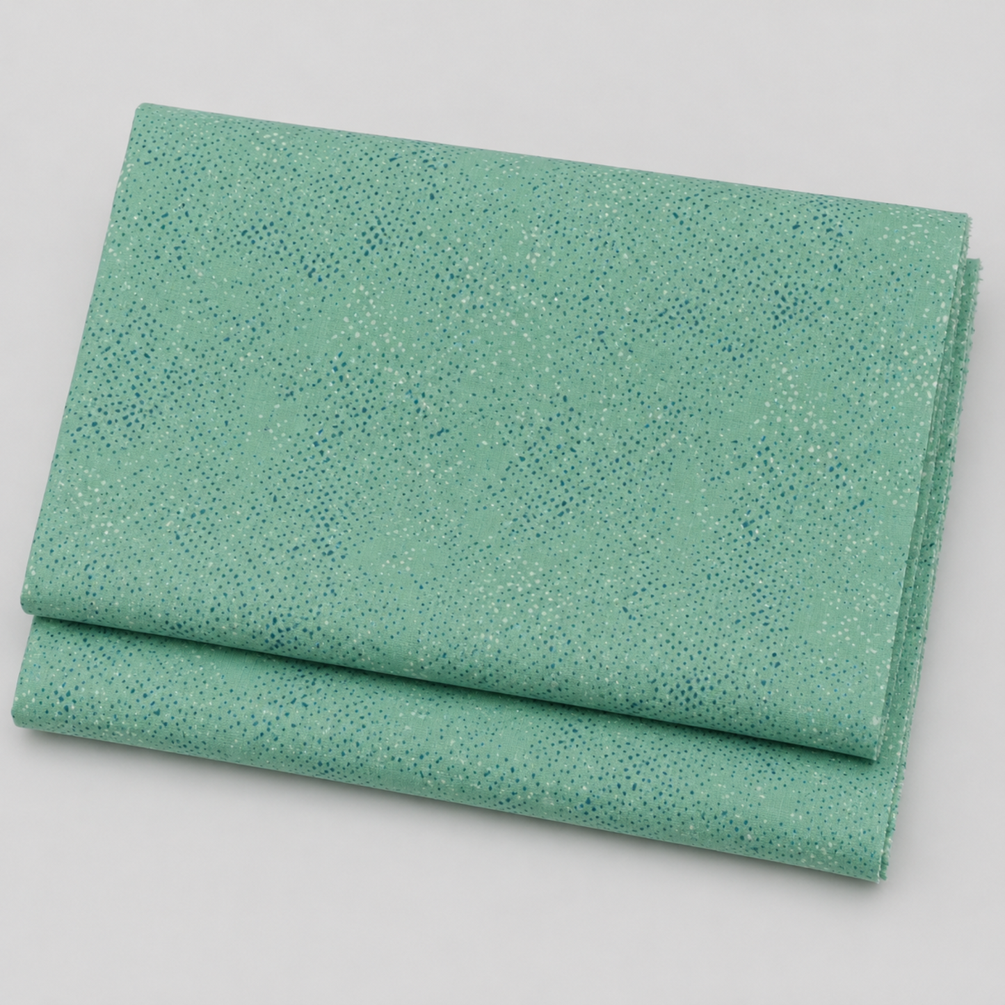 Spotted Chill-Aqua fabric by Zen Chic for Moda Fabrics — soft aqua-teal ground with scattered multi-toned dot texture, 100% cotton quilting blender, 44–45" wide. Available at IraRobi Quilts.