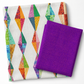 Interwoven Plum quilting fabric by Jason Yenter paired with a Diamond Daze quilt by Sew Kind of Wonderful — vivid purple-violet Interwoven geometric crosshatch fabric folded alongside the finished quilt showing elongated diamond blocks in coordinating jewel-tone fabrics