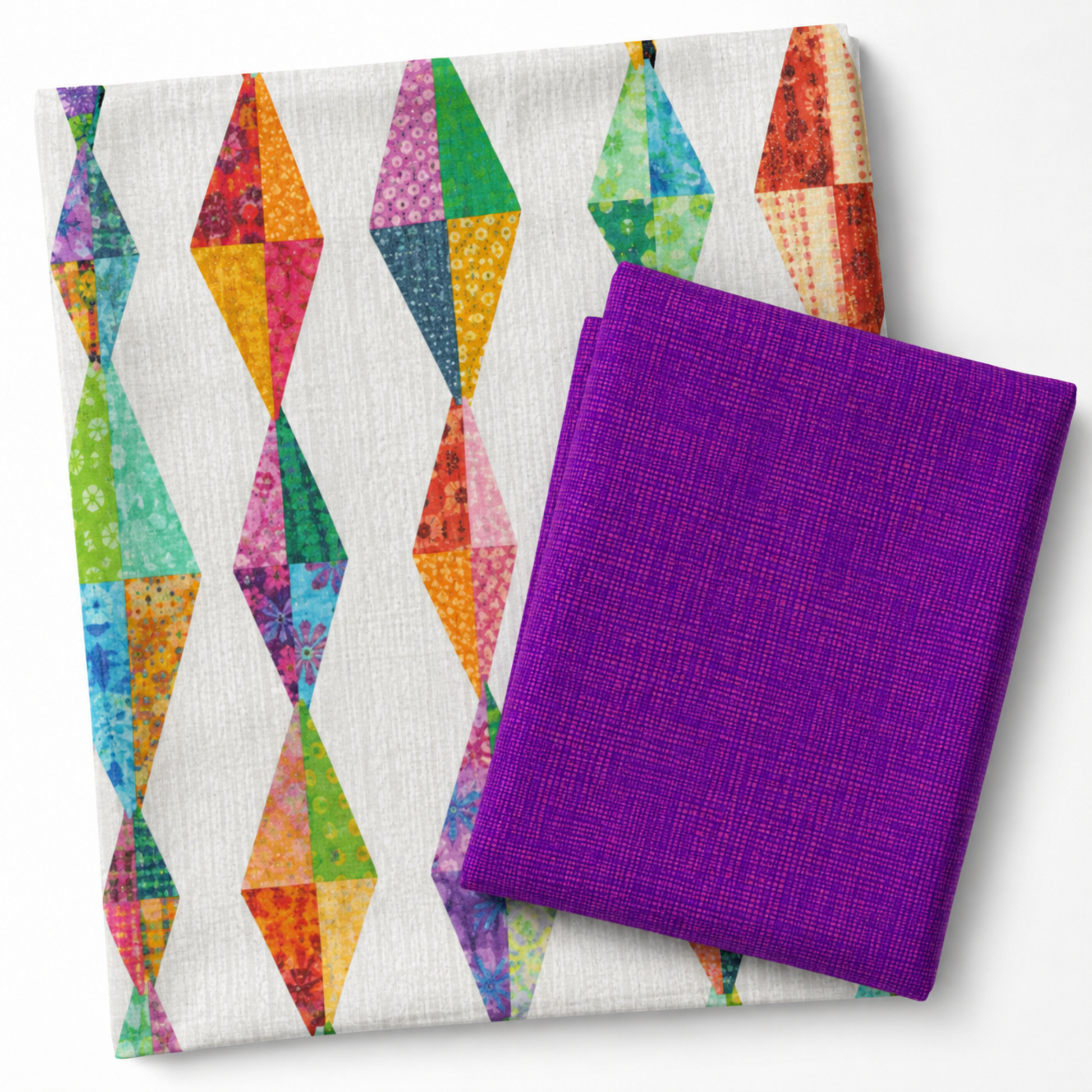 Interwoven Plum quilting fabric by Jason Yenter paired with a Diamond Daze quilt by Sew Kind of Wonderful — vivid purple-violet Interwoven geometric crosshatch fabric folded alongside the finished quilt showing elongated diamond blocks in coordinating jewel-tone fabrics