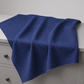 Thatched Navy quilting cotton fabric by Robin Pickens for Moda Fabrics draped over a white dresser with soft natural folds showing the rich deep navy blue tonal crosshatch texture and raw cut edges. Available at IraRobi Quilts.