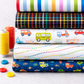 On the Go Stripes Multi quilting cotton styled for children's quilting project inspiration