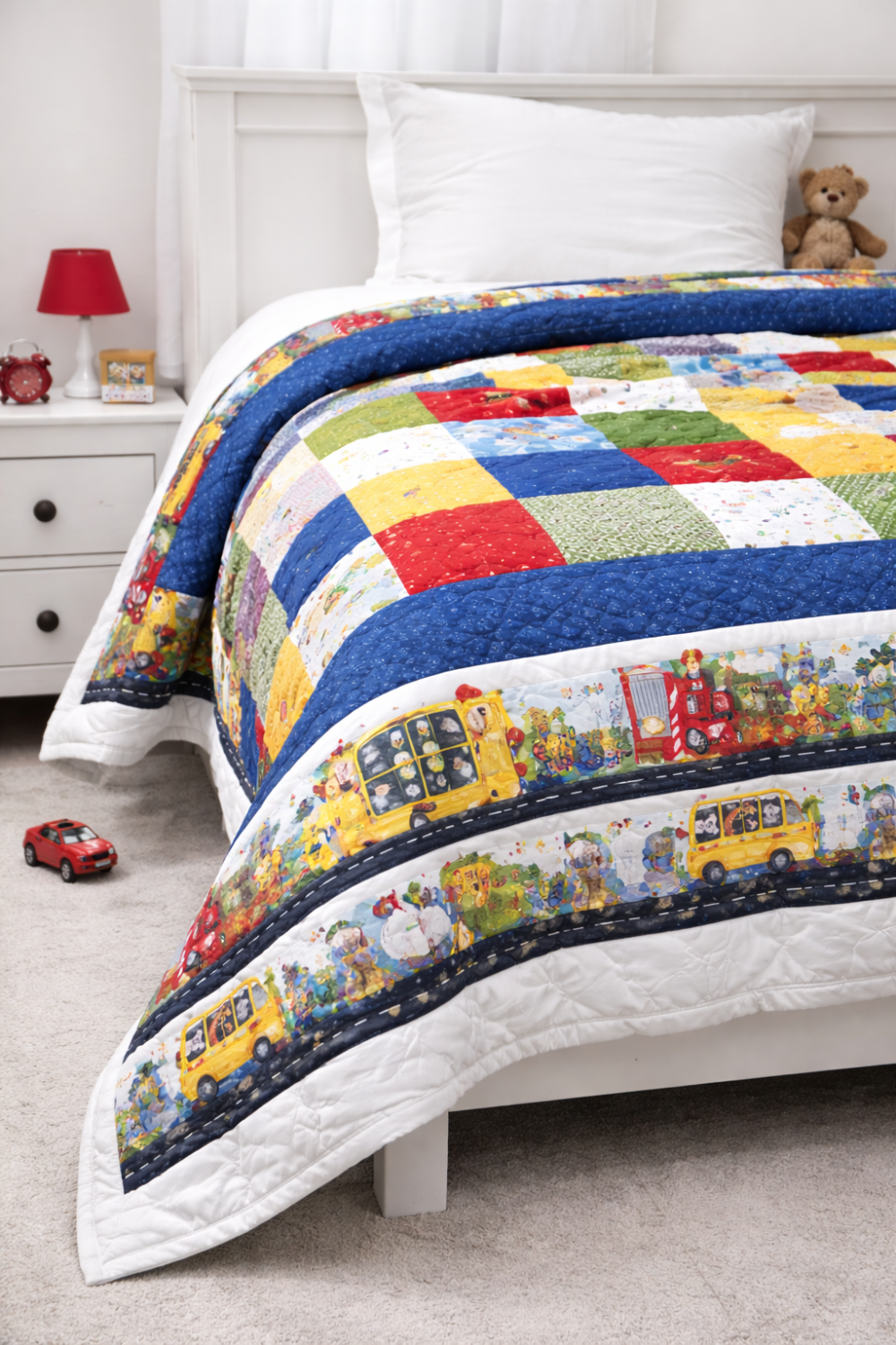 Quilting cotton On the Go border stripe fabric used as a quilt border around patchwork blocks, vertical lifestyle application on light grey background showing design in context