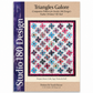 Triangles Galore quilt pattern DTTP102 by Sarah Furrer for Studio 180 Design — scrappy flying geese and triangle blocks in multicolor batiks on white background with raspberry border — available in crib, lap, twin, and full sizes — requires Tucker Trimmer III tool