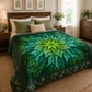 Dream Big Leaf Mint Quilt Panel by Jeanie Sumrall-Ajero for Hoffman Fabrics — displayed as a finished quilt draped over a wooden bed with sage green and cream pillows — mint, teal, and deep green leaf mandala — botanical prints on wall, plants, and warm wood dresser