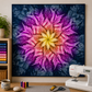 Dream Big Leaf Paradise Quilt Panel by Jeanie Sumrall-Ajero for Hoffman Fabrics — displayed as a wall quilt above a quilting workspace — vibrant pink, purple, orange, and yellow leaf mandala on navy — Janome sewing machine, green plant, cutting mat, scissors, and thread spools on wooden table
