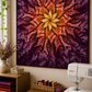 Dream Big Leaf Mulberry Quilt Panel by Jeanie Sumrall-Ajero for Hoffman Fabrics — hung as a wall quilt in a cozy quilting studio — deep purple and burgundy leaf mandala with orange and gold center — Bernina sewing machine, stacked warm-toned fabrics, dried botanicals, and cutting mat below — available at IraRobi Quilts