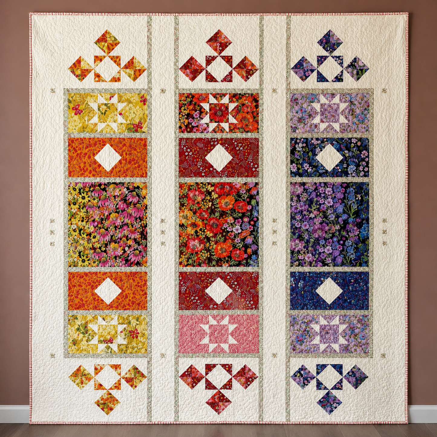 Joyful Trio quilt pattern by Robin Pickens featuring Superbloom fabric collection by Robin Pickens for Moda Fabrics — three-column medallion quilt with pinwheel blocks and framed floral panels in warm orange, jewel red, and cool purple colorways using Superbloom prints on cream background — Joyful Trio pattern available at IraRobi Quilts