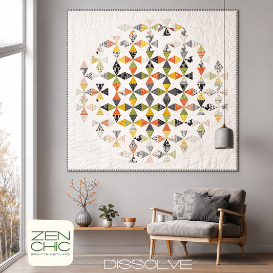 Dissolve quilt pattern by Zen Chic — foundation paper piecing circular ombré quilt in multicolor geometric fragments fading from bold darks to whisper white, 61" x 61", displayed on wall in modern living room — available at IraRobi Quilts