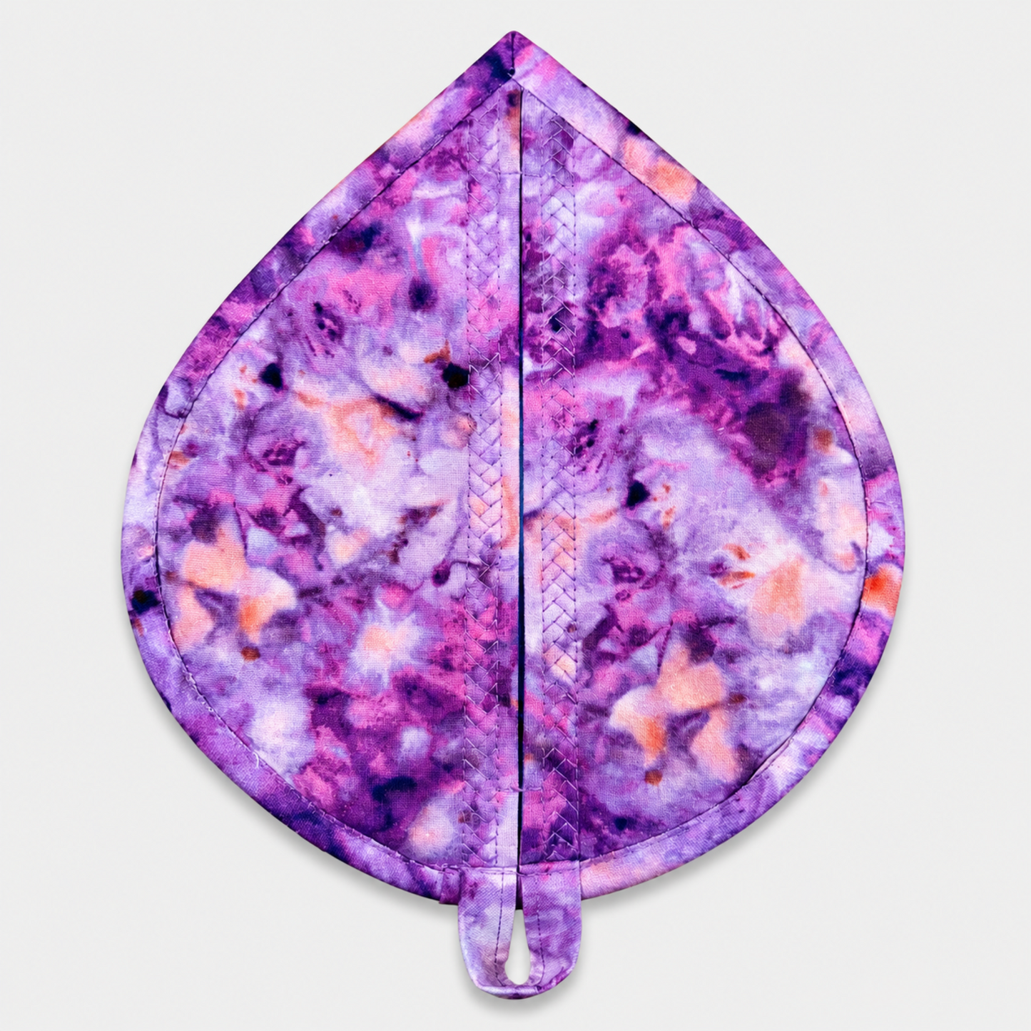 Leaf-Shaped Quilted Hot Pad – Violet Bloom, back view showing purple, lavender, pink, and peach abstract watercolor marbled batik with soft pink binding and crosshatch quilting – handmade by IraRobi Quilts