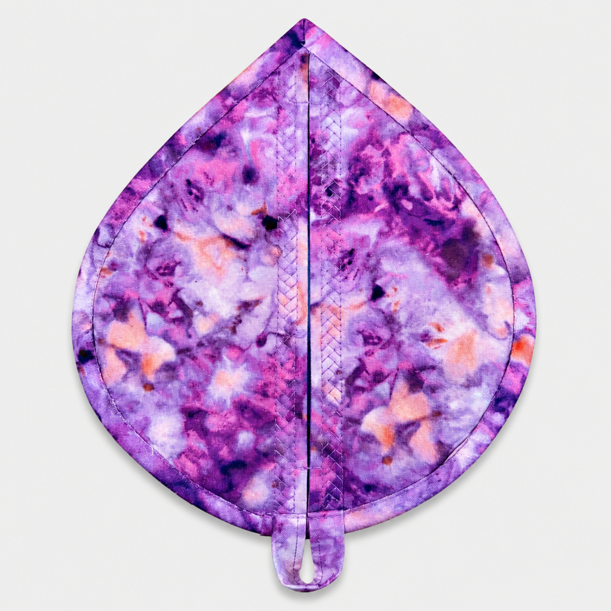 Leaf-Shaped Quilted Hot Pad – Violet Bloom, back view showing purple, lavender, pink, and peach abstract watercolor marbled batik with soft pink binding and crosshatch quilting – handmade by IraRobi Quilts