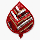 Leaf-Shaped Quilted Hot Pad – Christmas Red, front view showing patchwork strips of holiday fabrics including snowflakes, wood grain, and red prints – handmade by IraRobi Quilts