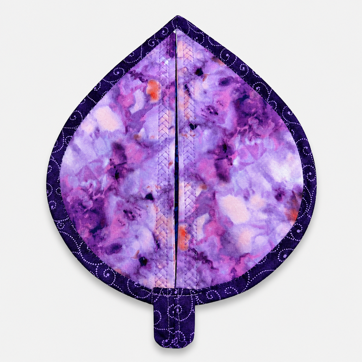 Leaf-Shaped Quilted Hot Pad – Violet Jewel, back view showing purple watercolor batik fabric with deep navy dot-swirl border binding – handmade by IraRobi Quilts