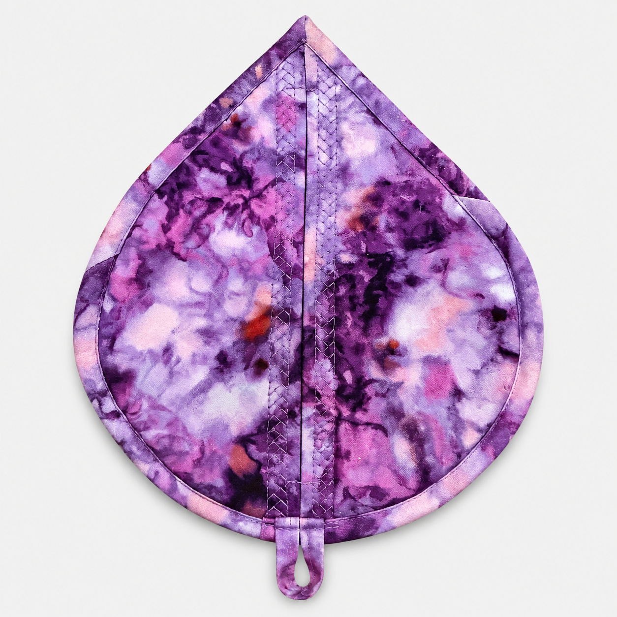 Leaf-Shaped Quilted Hot Pad – Purple Garden, back view showing abstract watercolor batik in purple, pink, lavender, and white with crosshatch quilting and hanging loop – handmade by IraRobi Quilts