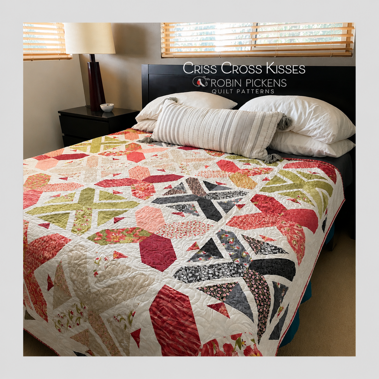 Criss Cross Kisses queen size quilt by Robin Pickens on bed showing full layout of X blocks and arrowhead sashing in pink, green, crimson, navy and floral prints on cream background with red binding