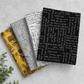 Writing on the Wall Curves Black quilting cotton on top of a coordinating fabric stack – Sew Kind of Wonderful for FreeSpirit Fabrics
