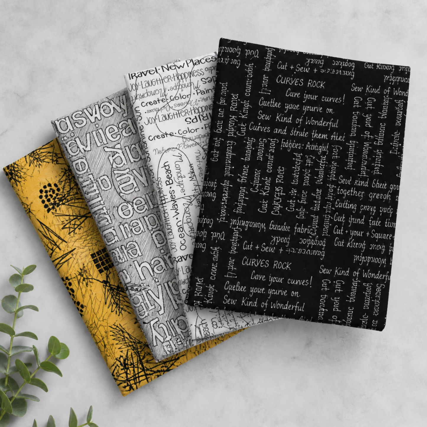 Writing on the Wall Curves Black quilting cotton on top of a coordinating fabric stack – Sew Kind of Wonderful for FreeSpirit Fabrics