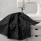 Writing on the Wall Curves Black quilting cotton draped over a sewing machine – white script print on black by Sew Kind of Wonderful for FreeSpirit