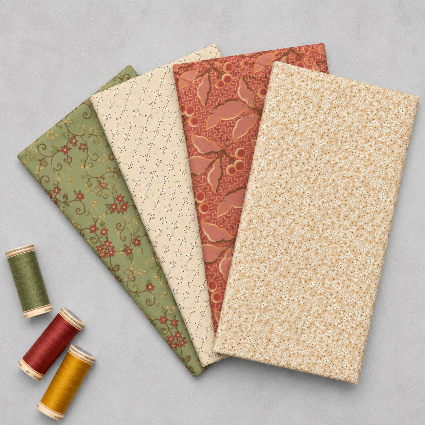 The Fox Homestead by Stacy West for Henry Glass — four quilting cottons fanned flat showing sage floral vine, cream speckle, terra cotta berry leaf, and cream ditsy blender prints, with olive, burgundy, and gold thread spools