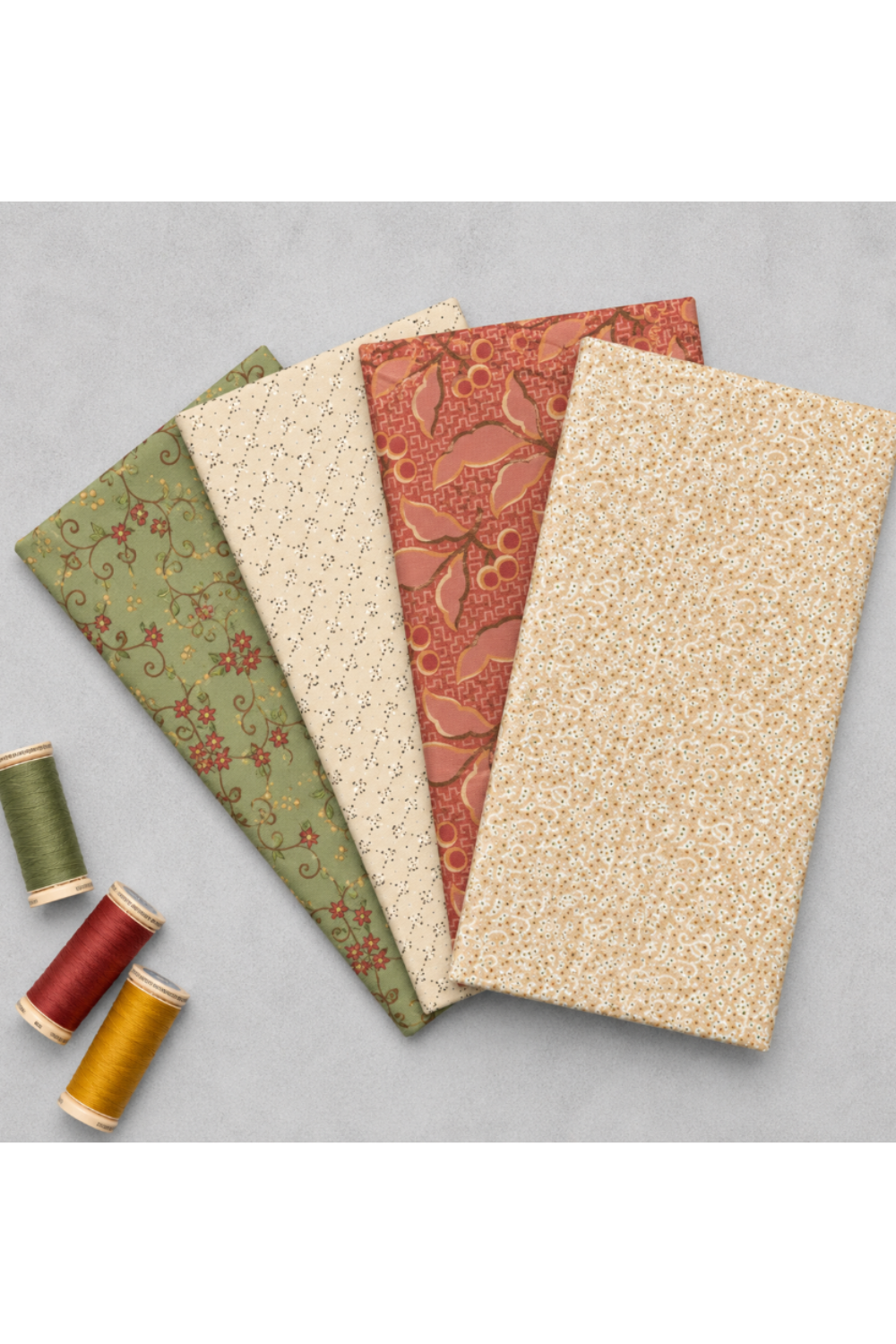 Fox Homestead Pink Leaves and Berries Fabric by Stacy West for Henry Glass — shown in a coordinating fan with matching Fox Homestead collection fabrics in sage green floral vine, cream ditsy, and terracotta floral, with burgundy, red, and gold thread spools. Quilt blocks shown for inspiration. Coordinating fabrics and quilt patterns are available at IraRobi Quilts.