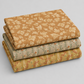 Coordinating quilting cottons from the Front Porch collection by Dolores Smith for Marcus Fabrics — stacked folds of rust-amber scrolling leaf print, sage green railings stripe, and olive-gold railings stripe, 100% cotton 43–44" wide