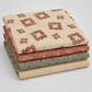 Coordinating quilting cottons from The Fox Homestead collection by Stacy West for Henry Glass — stacked folds of cream daisy clusters, dusty rose leaf-and-berry sprigs, slate blue-green tumbling cubes, and cream paisley swirl, 100% cotton 43–44" wide