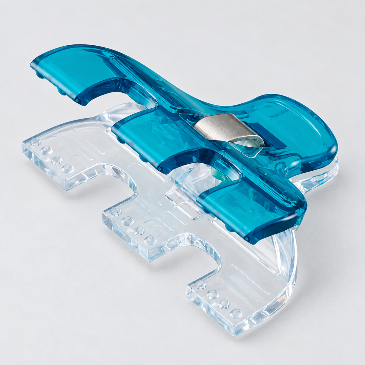 Angled overhead view of a single Clover Triple Wide Wonder Clip open, showing the three-section clear base and blue top handle