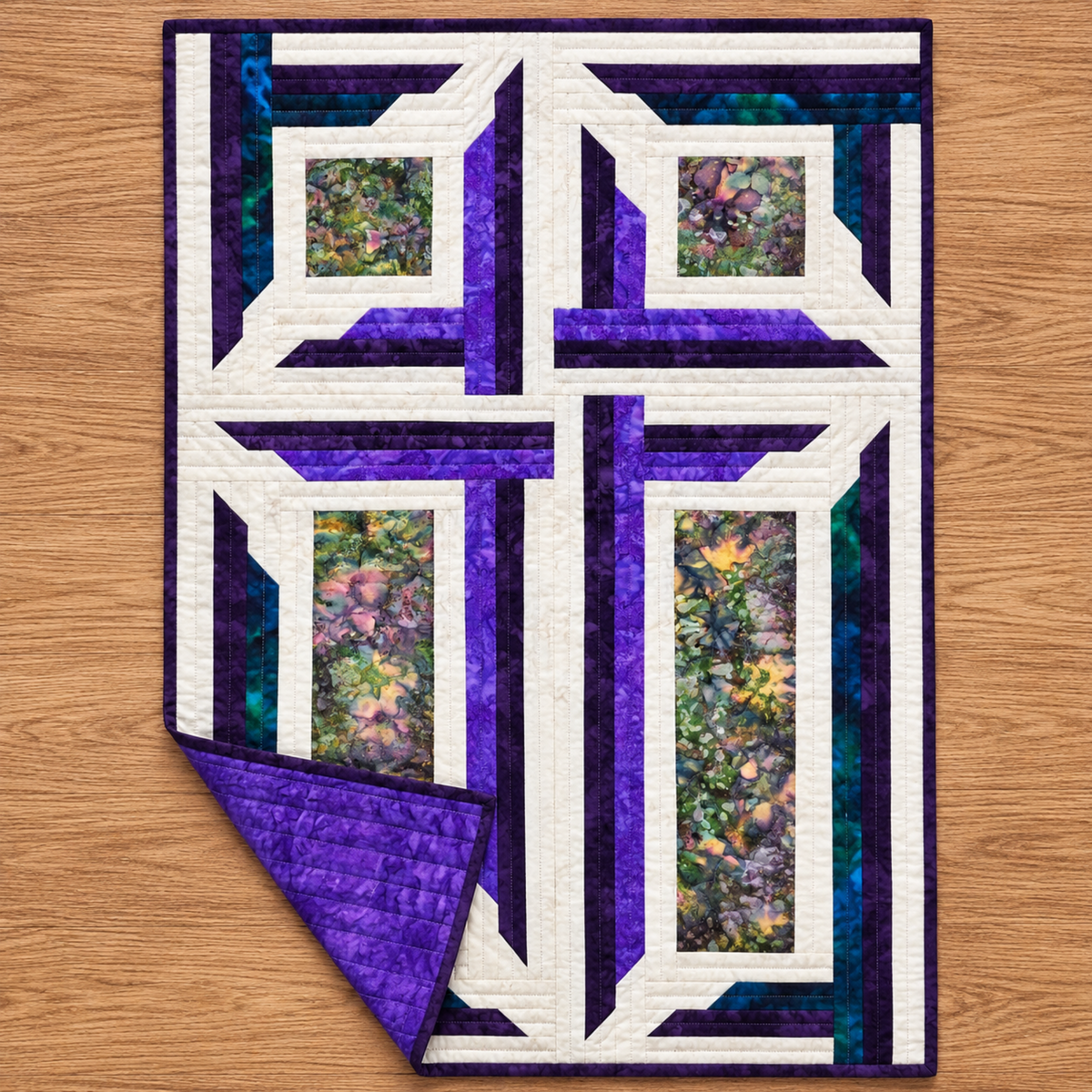 The Wondrous Cross wall quilt on an oak floor with one corner folded back to reveal purple backing and quilting stitches.
