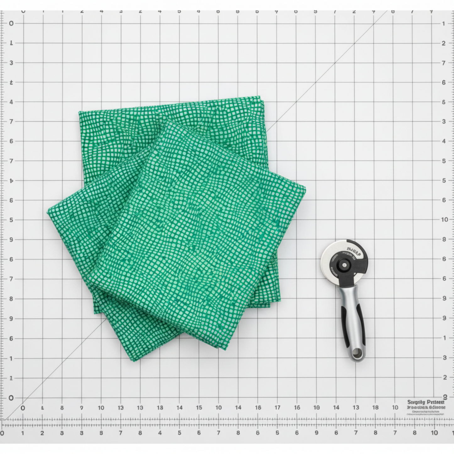 Impressions Mint Dots cotton fabric close-up with light mint dot pattern