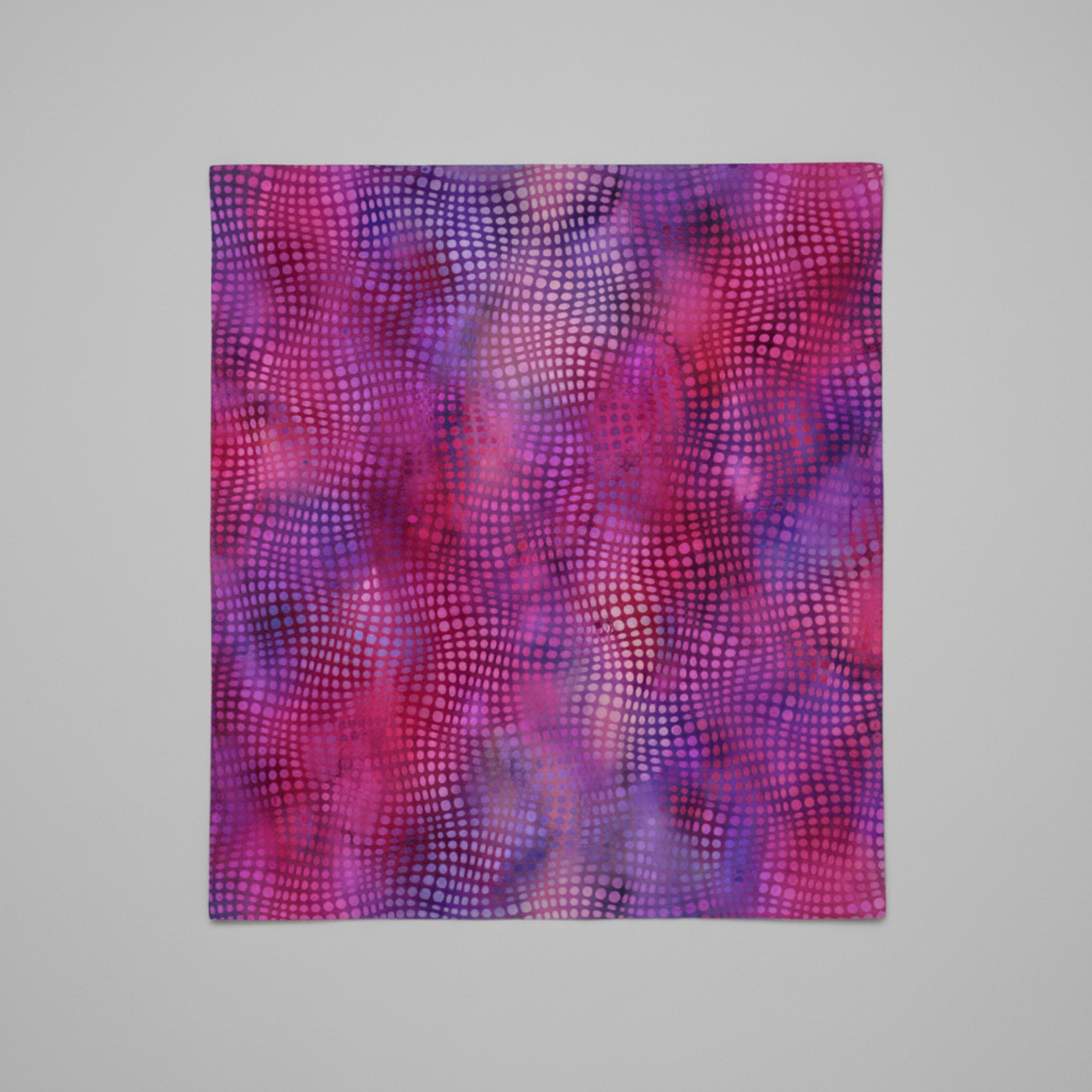 Close-up of Impressions Magenta Dots quilting cotton showing bold multicolored dots and texture