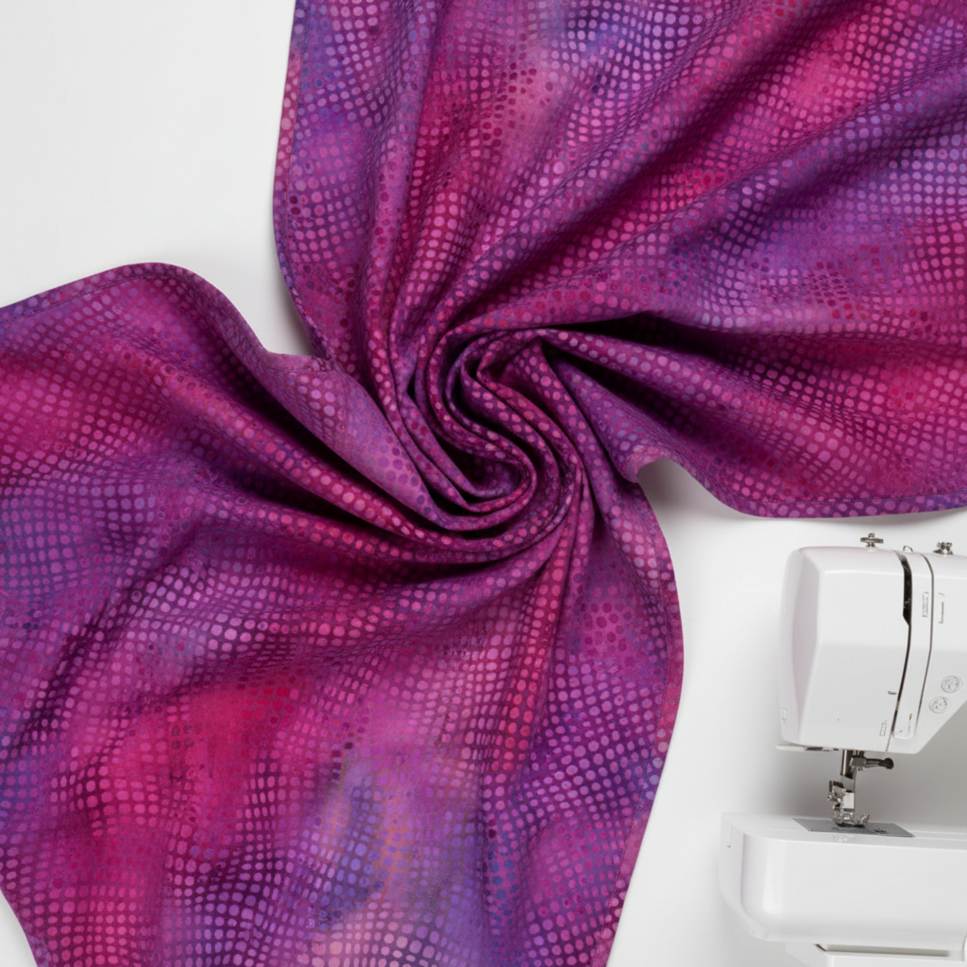 Repeating dot pattern on Impressions Magenta Dots quilting cotton fabric