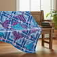 Fire & Ice quilt draped over wooden bench showing scale and softness