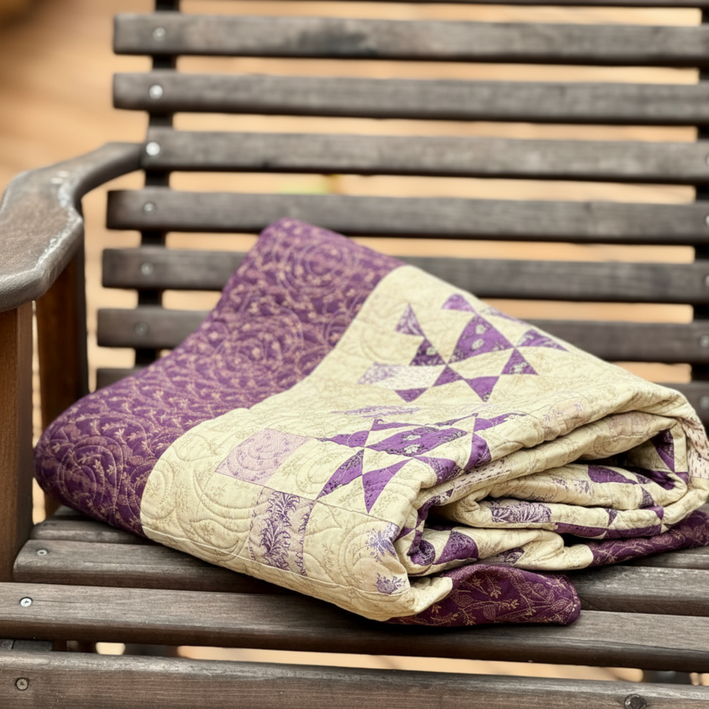 Folded handmade purple star quilt showing thickness and quilting texture